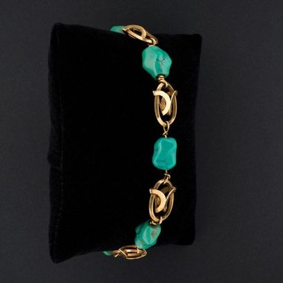 null Bracelet articulé or et turquoises baroques. 
Poids brut :23 g