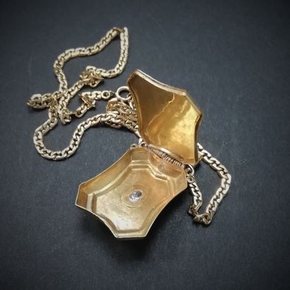null Gold photo holder pendant set with a rose cut diamond. With its gold chain horse...
