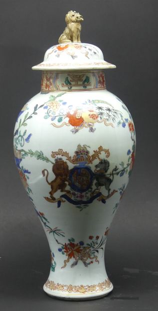 null A Famille Rose covered baluster vase, decorated with a coat of arms and plants.

China,...