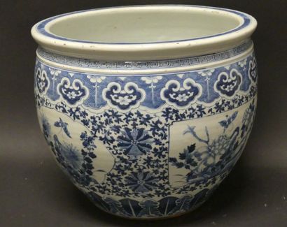 null A blue-white porcelain fishbowl decorated with plants and butterflies in cartouches,...