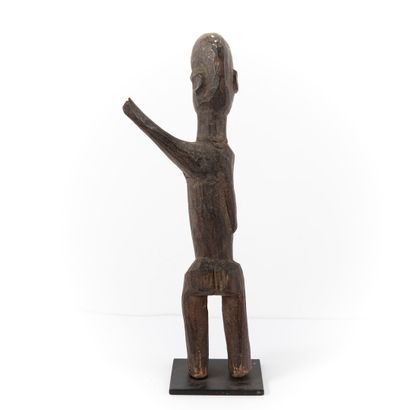 null LOBI- BUKINA FASO 

Female figure with arm raised to the left 

patina of u...