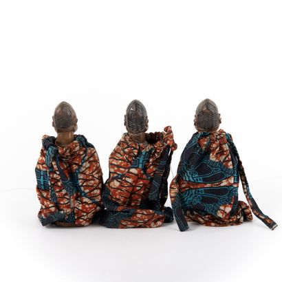 null NAGO - BENIN 

Triplets dressed in a traditional costume with pearl necklace...