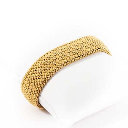 Braided gold bracelet 

Circa 1960 

Weight:...