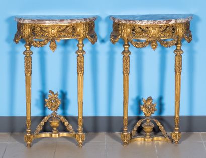 null Pair of carved and gilded wood consoles, openwork belt, tapered legs. Marble...