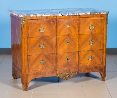 null Chest of drawers with a slight overhang in inlaid wood opening to three drawers.

Transitional...