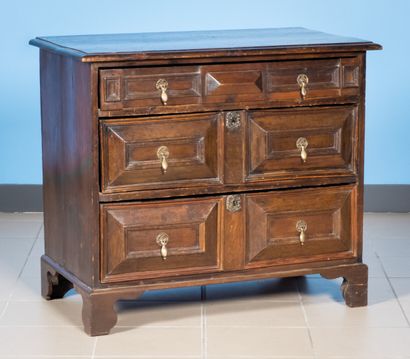 null Stained wood chest of drawers opening with four drawers on three rows

England,...
