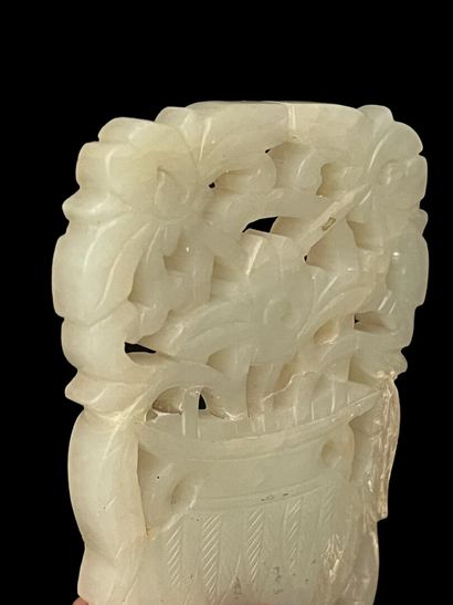 null Celadon jade pendant with a flower basket design.

China, 19th century.

8 x...