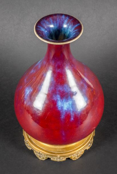 null Porcelain and oxblood enamel piriform vase, lavender blue flames on the base...
