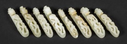 null Eight celadon jade fibulas carved with double dragons.

China, Jianquing period

Between...