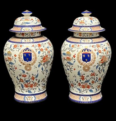 Pair of polychrome porcelain covered vases...