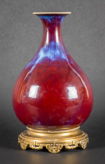 Porcelain and oxblood enamel piriform vase,...