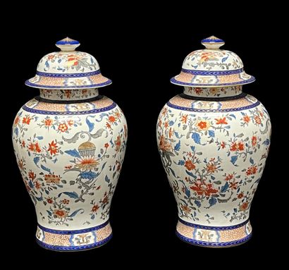 null Pair of polychrome porcelain covered vases with Imari and coat of arms decoration.

China,...