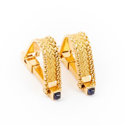 null Pair of cufflinks, braided and corded gold finished with cabochon sapphires....