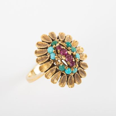 null Ring daisy ruby surrounded by turquoise cabochon, textured gold setting 

Gross...