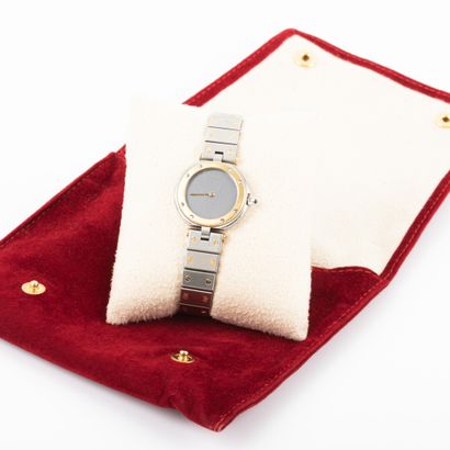 null CARTIER-Paris.

Lady's watch, gold and steel case and bracelet, quartz movement...