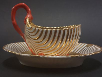 null Paris



Porcelain cup and saucer in the shape of a shell with gold decoration,...