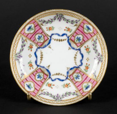 null Paris



Porcelain bowl and saucer with polychrome and gold decoration of garlands...