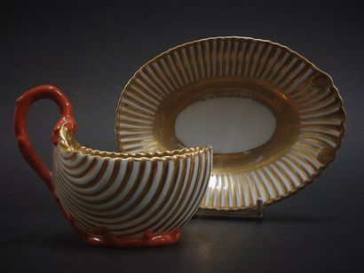 null Paris



Porcelain cup and saucer in the shape of a shell with gold decoration,...