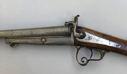 null Lot of two antique shotguns. There is a double rifle primitively with flint,...