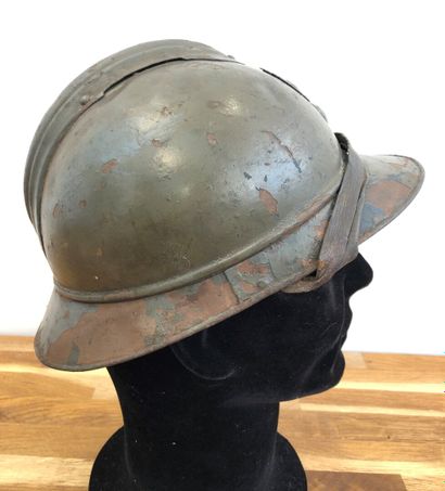 null Adrian helmet model 1915 of infantry repainted green on blue horizon base, with...