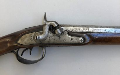 null Lot of two antique shotguns. There is a double rifle primitively with flint,...