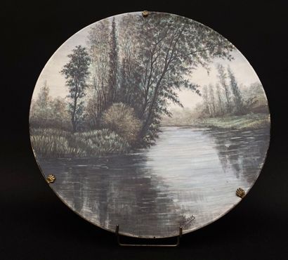 null J. LORIN, 1887

Polychrome porcelain dish decorated with a lake landscape.

Diameter...