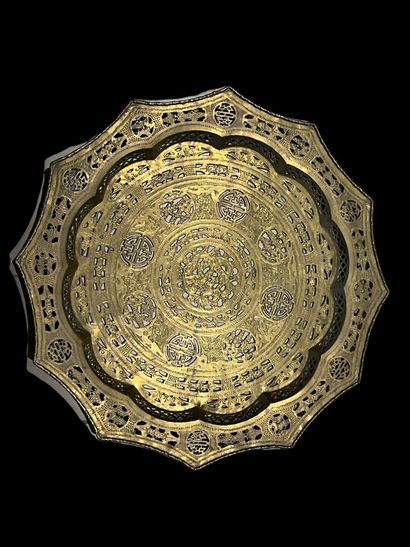 null Floriform tea tray, in chased and openworked copper, decorated with characters...