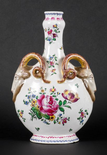 null Earthenware flask with polychrome decoration of flowers. Holders decorated with...