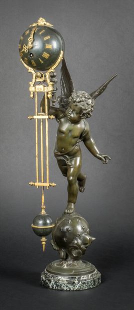 null Regula clock decorated with an angel holding in his hand the spherical dial...