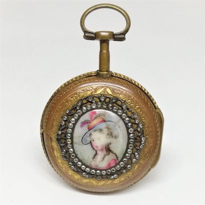 null 
Gilded metal, enamel and rhinestone pocket watch.




On the back cover, oval...