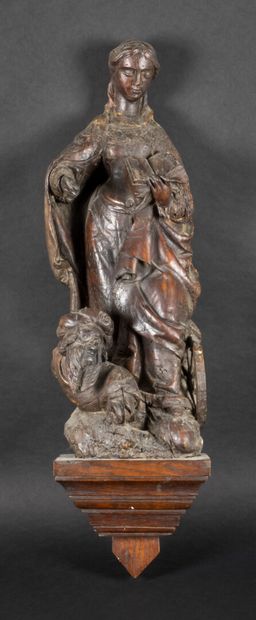 null Saint Catherine of Alexandria in carved wood, rough back

16th century

H :...