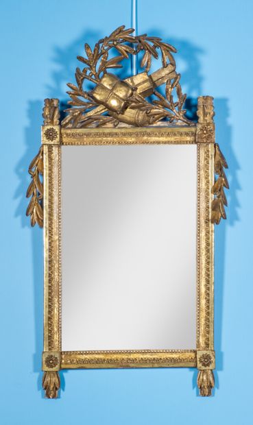 null Rectangular glass, wooden frame carved with rais-de-coeur, pearl border, and...