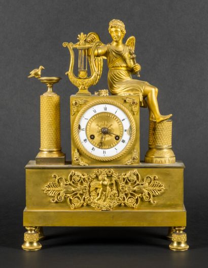 Gilt bronze clock decorated with a musical...