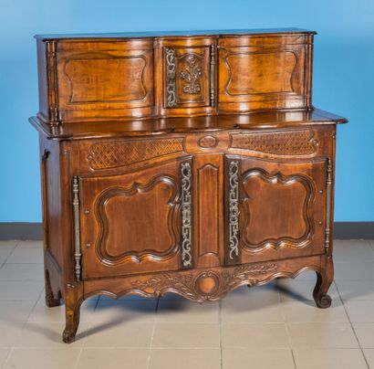 null Sliding sideboard in fruitwood, with a small curved door carved with a bouquet...