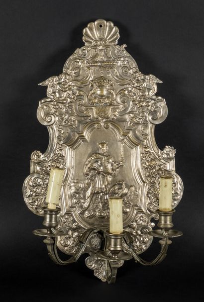 null Suite of four three-light sconces in silvered bronze decorated with divinities...