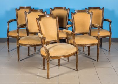 null Suite of six armchairs in molded wood, gendarme hat back, fluted legs.

Louis...