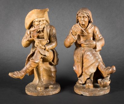Two subjects in terra cotta, seated figures...