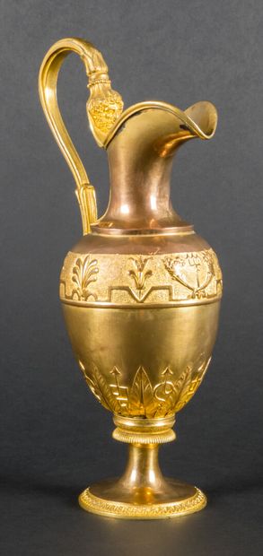 null 
Ewer or pourer in gilded metal with stylized decoration of foliage.




Take...