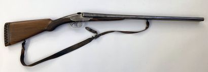 null Rifle juxtaposed with fixed barrels Charlin model with two hares. Caliber 12/70....