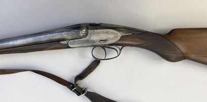 null Rifle juxtaposed with fixed barrels Charlin model with two hares. Caliber 12/70....