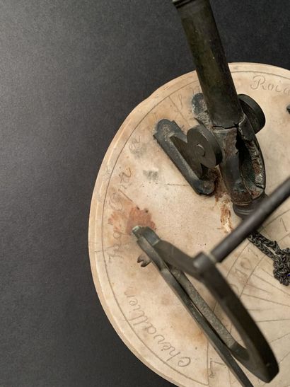 null Marble and bronze noon gun composed of a sundial with its axis and optical lens...