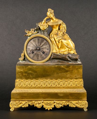 Romantic clock in gilded and patinated bronze...