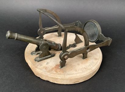 Marble and bronze noon gun composed of a...