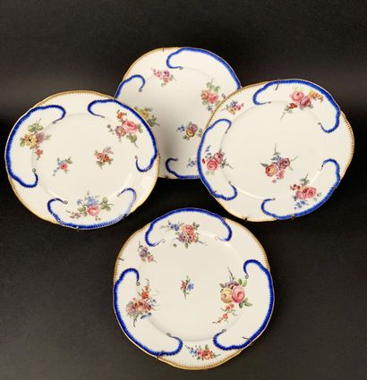 null Set of four plates with scalloped edges in polychrome and gilded porcelain decorated...