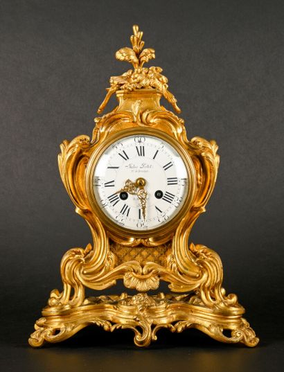 null Clock in gilt bronze, dial marked "Jules PETIT, Paris".

Rocaille style XIXth...