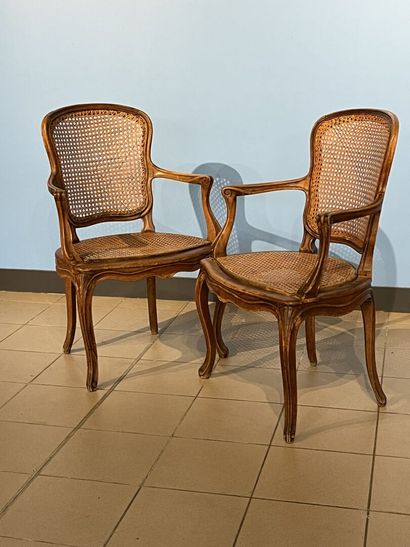 Pair of molded wood armchairs, cane seat

Stamped...
