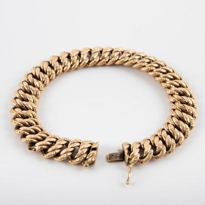null Bracelet gourmette, maille anglaise or 18K.
Vers 1960
Poids: 23.1 g -L: 20 cm-...