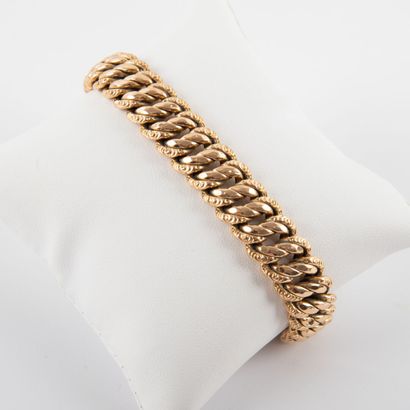 null Bracelet gourmette, maille anglaise or 18K.
Vers 1960
Poids: 23.1 g -L: 20 cm-...