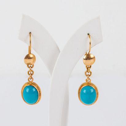 * Pair of turquoise earrings set in 18K gold
Gross...