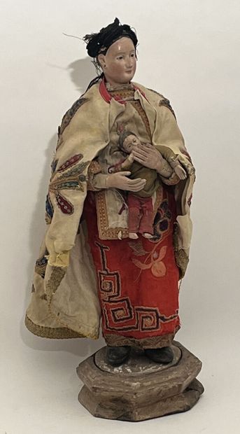 Polychrome wood sculpture and embroidery...